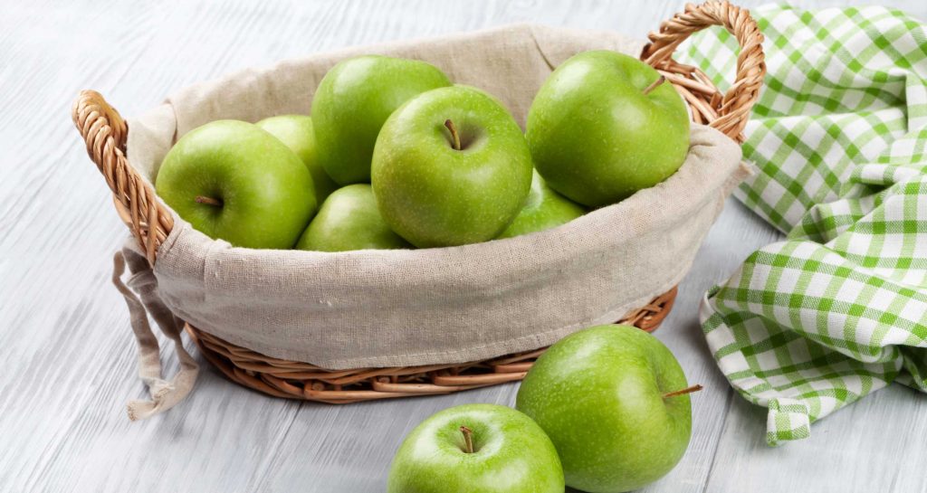 basket of green apples