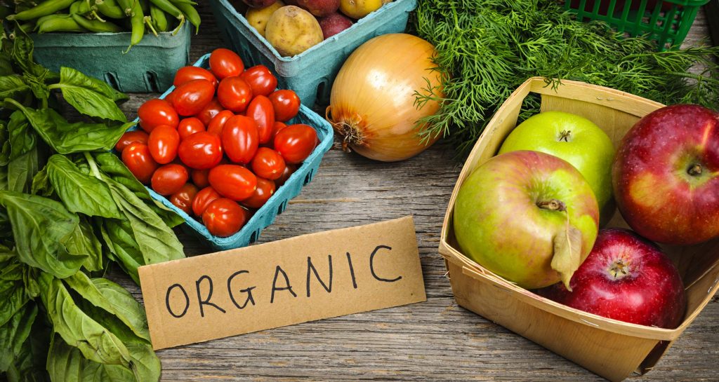 organic fruits and vegetables with sign