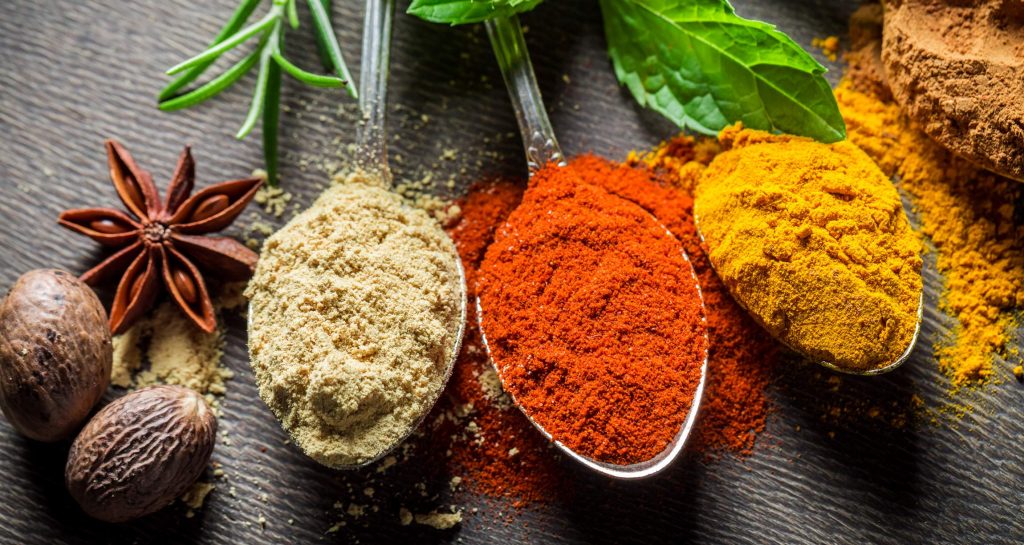 Colorful spices in spoons